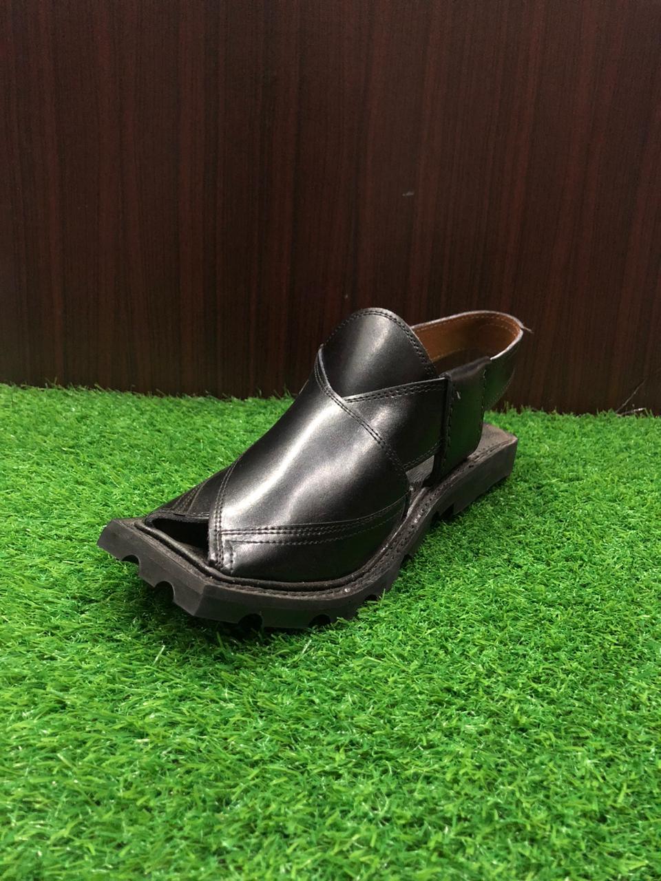 Close-up of a pair of Peshawari Chappals, highlighting the elegant leather material and the traditional, handcrafted design that makes them a timeless fashion choice in Pakistan."