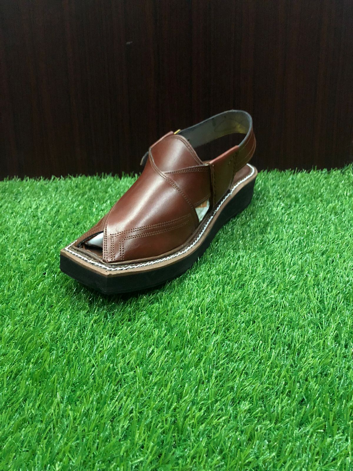 Traditional Peshawari Chappals with a sleek design, crafted from soft leather and adorned with fine stitching, representing the rich cultural heritage of Peshawar, Pakistan."