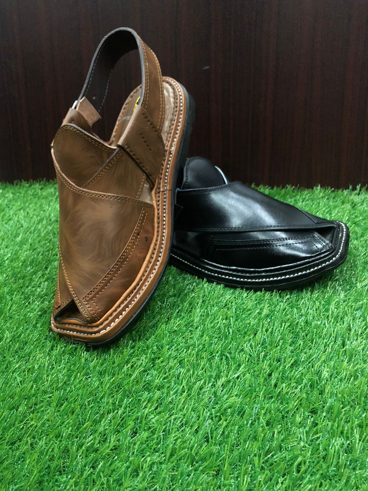 "A pair of Peshawari Chappals crafted from high-quality pure leather, featuring a triple-gair design with a stylish double-shade color combination. The intricate stitching and durable construction make these chappals both elegant and long-lasting."