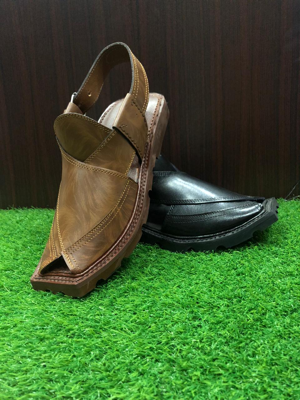 "A pair of classic brown leather Peshawari Chappals, designed with intricate hand-stitched patterns and a traditional open-toe style, popular in Pakistani culture."