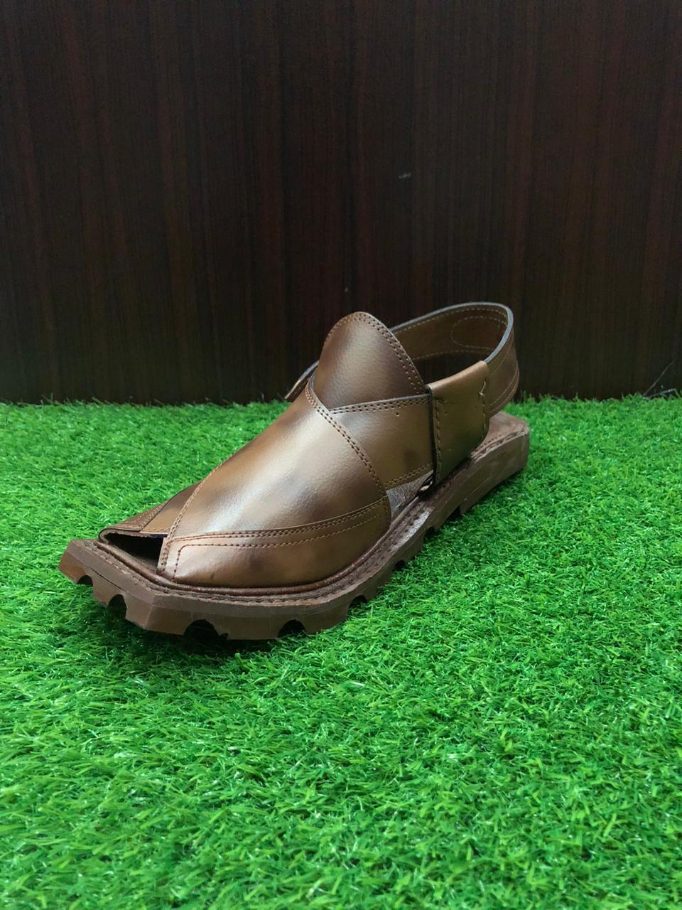 A high-quality Peshawari Chappal made from brown leather, showcasing a stylish yet comfortable design with detailed craftsmanship, perfect for both casual and formal wear."

