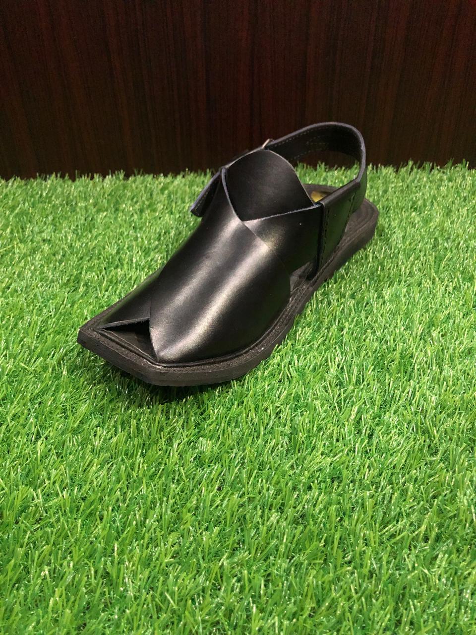 Handcrafted Peshawari Chappal sandals, made from soft leather, with a unique open-toe design and thick soles, worn for both casual and formal occasions in Pakistan."